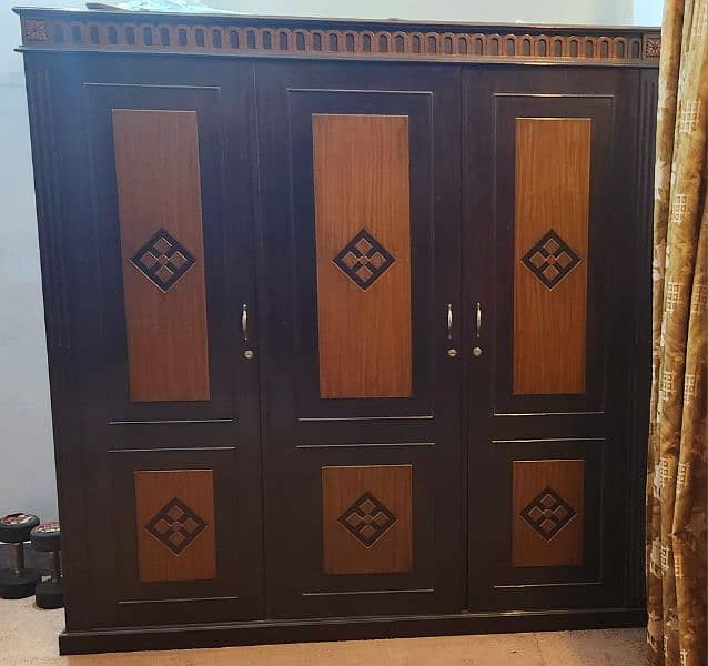 three door wooden wardrobe 0