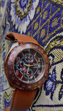 Brown Police Chronograph Watch with Leather Strap on Fabric Surface