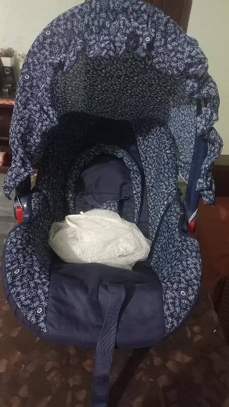 Very less used baby carry cot and car seat 2