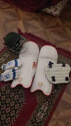 Cricket pads helmet gloves thigh