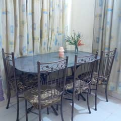 Dining table with 6 iron rod chairs