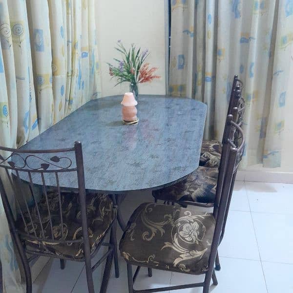 Dining table with 6 iron rod chairs 1