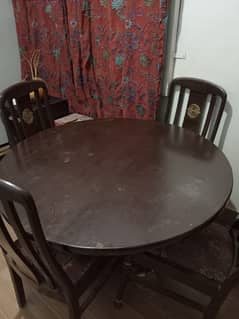 Wooden dinning table with free broken chairs , table is in super cond