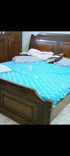 king size bed with side table and dressing