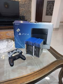 Playstation 4 with game cds