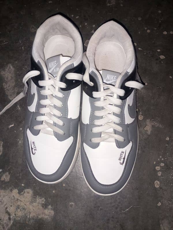 New brand Nike sneaker colour grey and  white one day use only 1