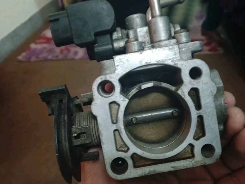 Suzuki liana ignition coil and throttle body for sale 1