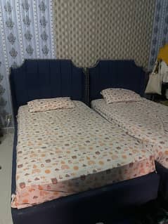 2 single bed with center table