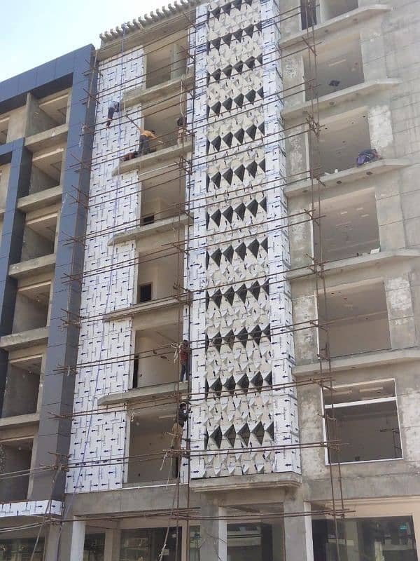 Wall cladding sheet and curtain wall, spider glass fitting 11