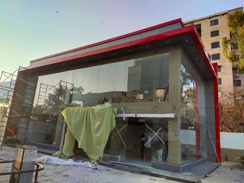 Wall cladding sheet and curtain wall, spider glass fitting 13