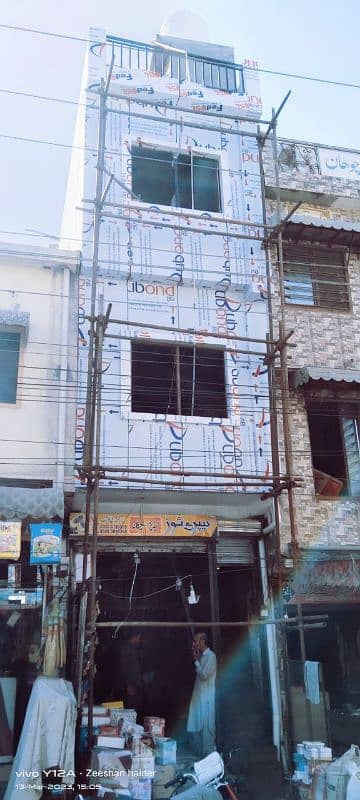 Wall cladding sheet and curtain wall, spider glass fitting 17