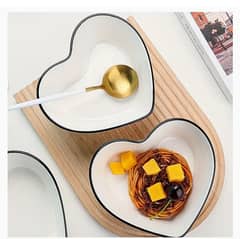 1 heart shaped bowl and 1 stripped sauce bowl