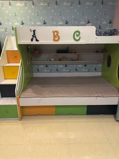 double bunk bed with fan inside and mattress