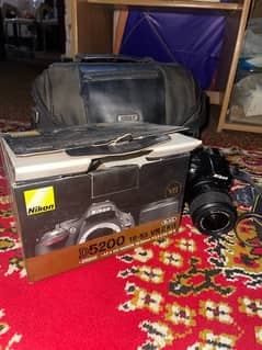 Nikon D5200 with 18-55mm lens, box, bag, charger and battery