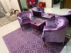 two sofa chairs/cushioned table/central table