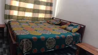 Neat and clean bed with spring mattress very comfortable and ok.