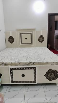 Bed with dressing and side table