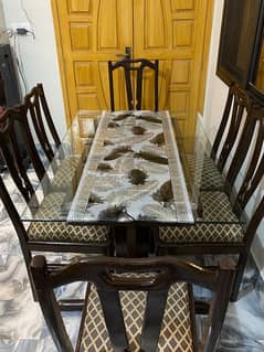 Wooden table with glass top