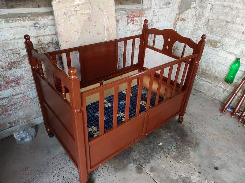 Baby cot In good condition newly polished With mattress 0