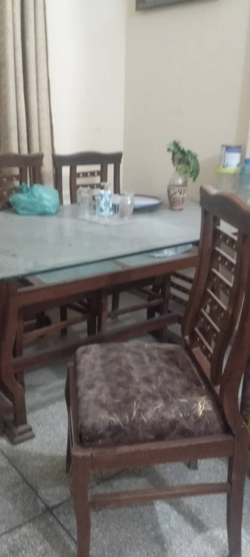 Wooden table with new covering on chairs 6 seaters 1