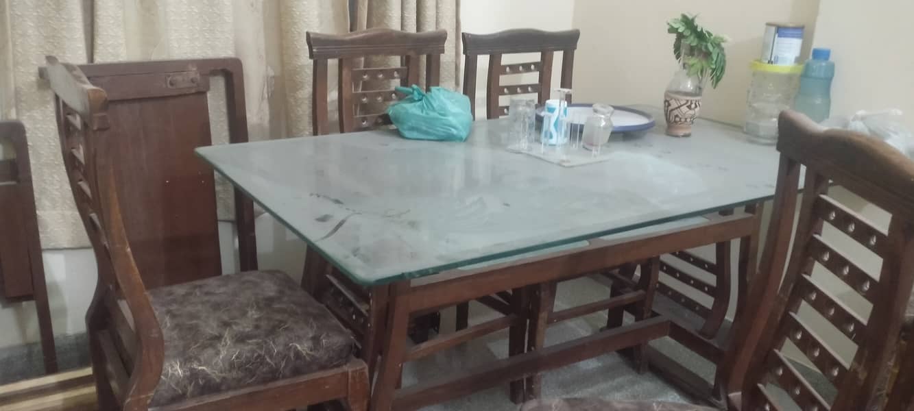 Wooden table with new covering on chairs 6 seaters 2