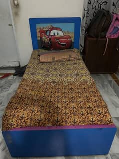 Bed with cupboard and study table