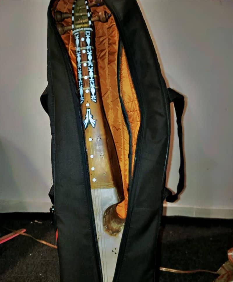 Rubab with extra wire extra pick and bag 2