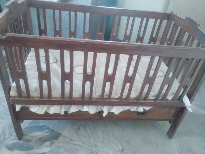 used shisham wood baby cot for sale 0