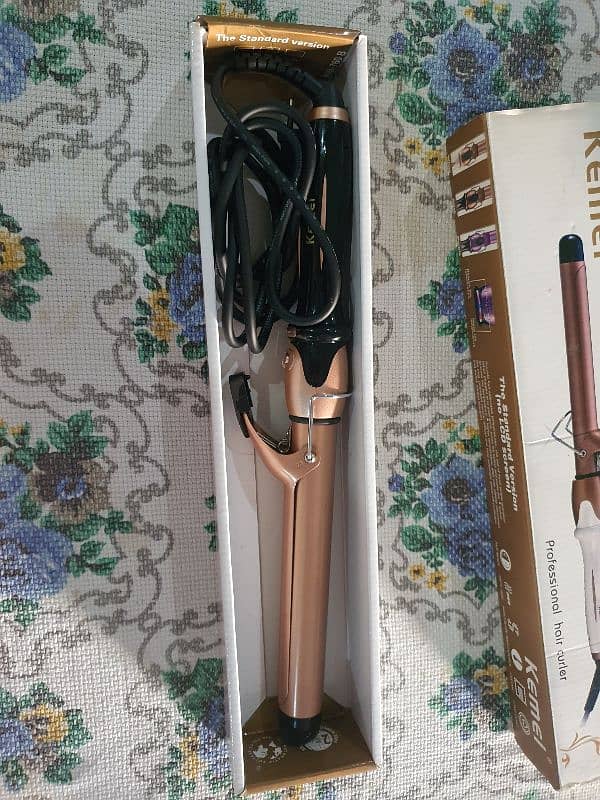 Kemei professional hair curler 1