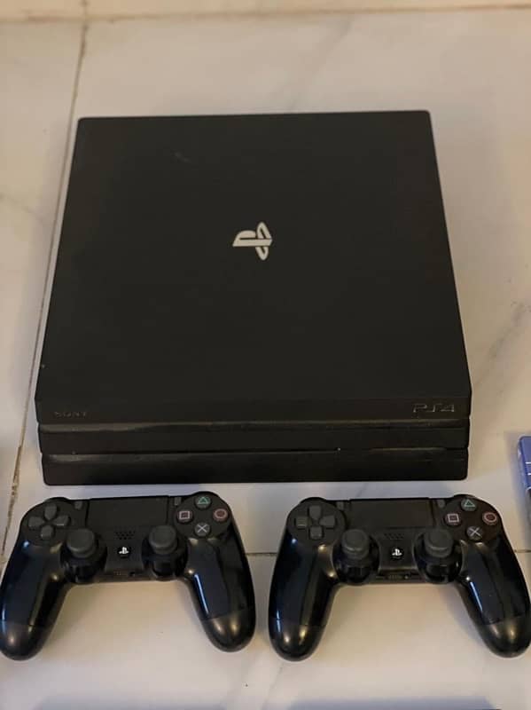 Play Station 4 Pro 1 TB ps4 with 2 controllers first owner with games 0