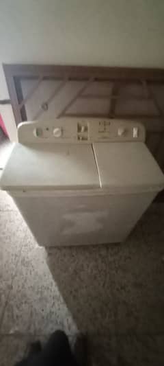 Washing machine with attached dryer.