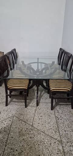 6 seater wooden dining table with glass top