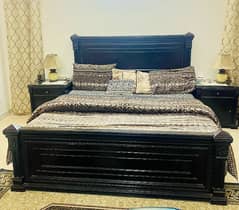 bed with side tables and dressing table