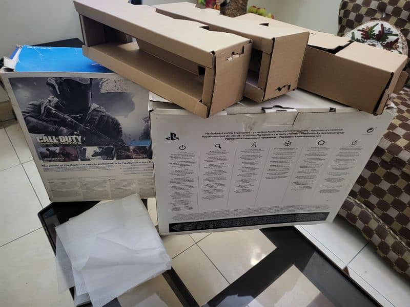 Ps4 Pro 1 TB original box and 2 controller 1