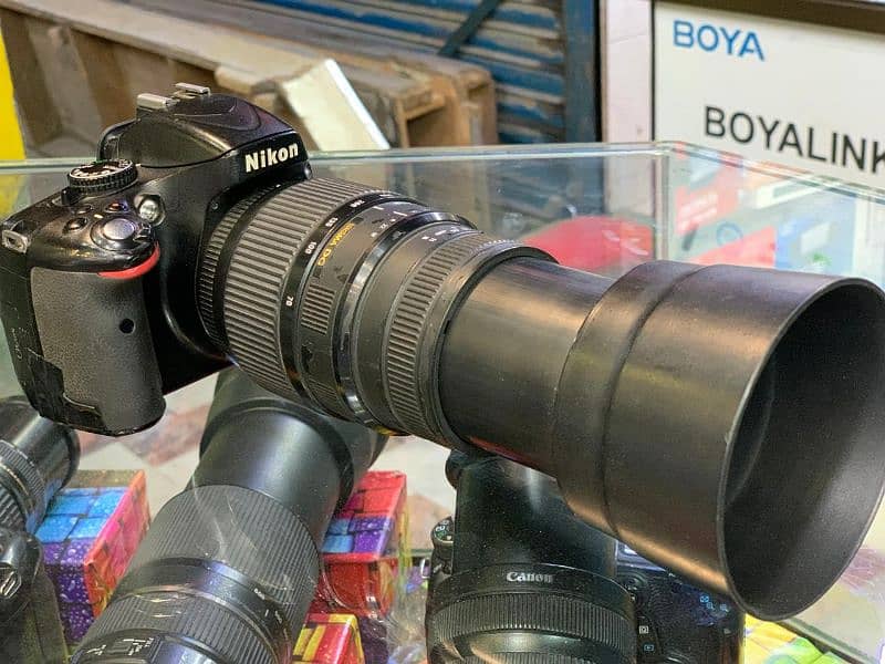 dslr camera naikon d5100 lens 70/300. mm Whatsapp and sim 03212306356 0