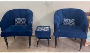 royal blue colored 2 chairs with table. .