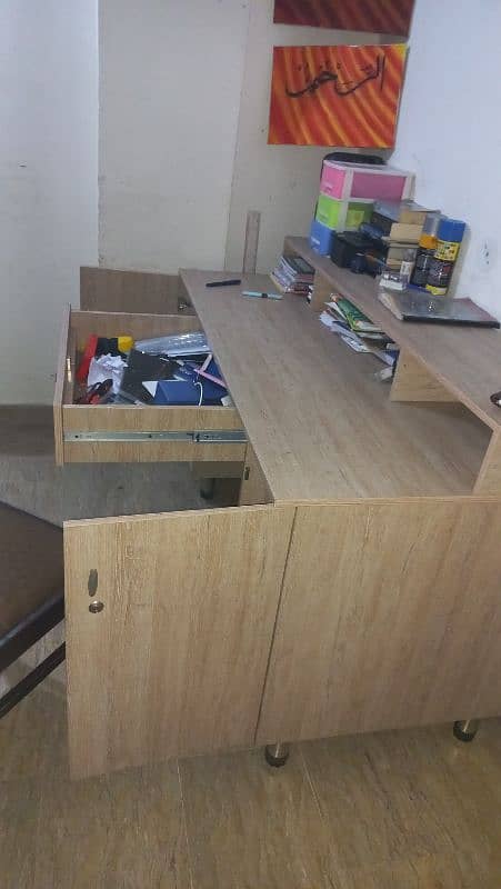 study table with drawer and side cabinets. 2