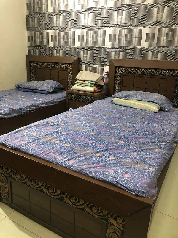 2 single beds with center table 2