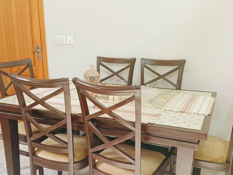 wooden framed glass top dining table + six chairs 0