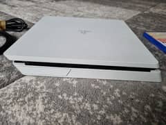 Sony PS4 slim 1tb playing games with controller and games