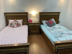 2 Single beds with 2 side tables ( mattress included)