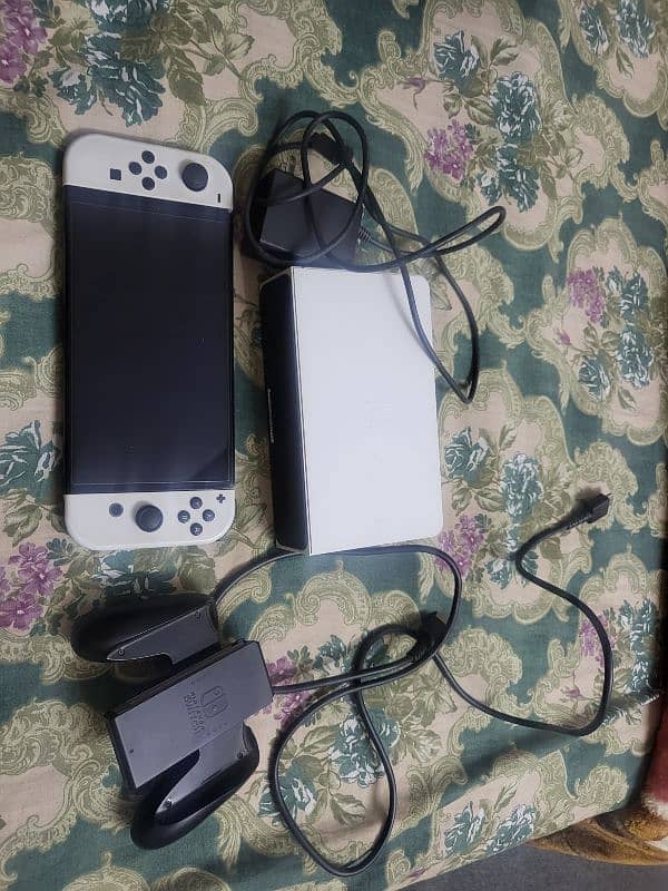 nintendo switch oled with 10 games 0