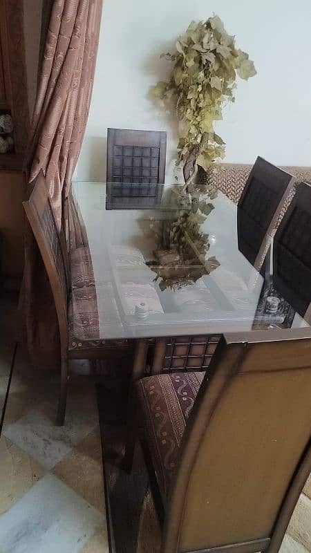 6 chairs and dining table with glass top 0