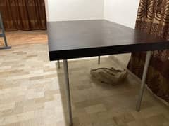 Table with chipboard top and steel supports