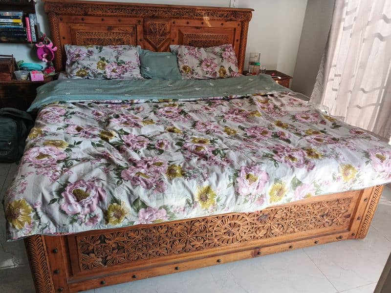 Swati wooden carved metal stidded king sized bed with 2 side tables 0