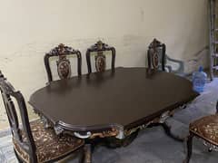 wooden dinning table and chairs