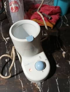 Feeder warmer and sanitizer