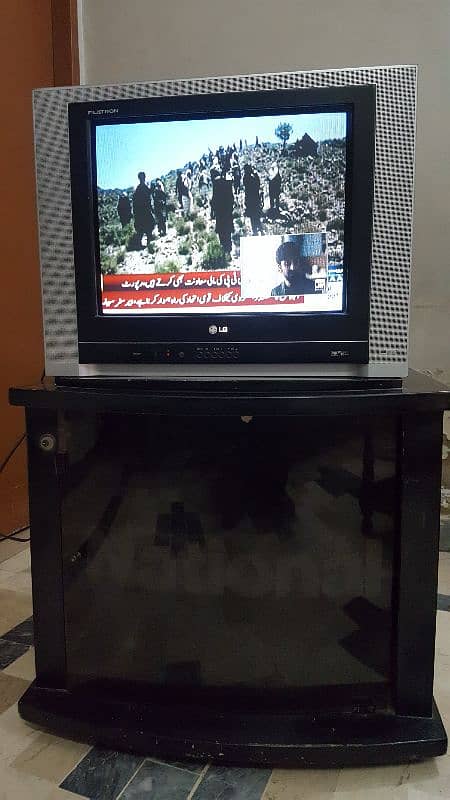 LG 21 inch CRT television with trolly and remote. 1