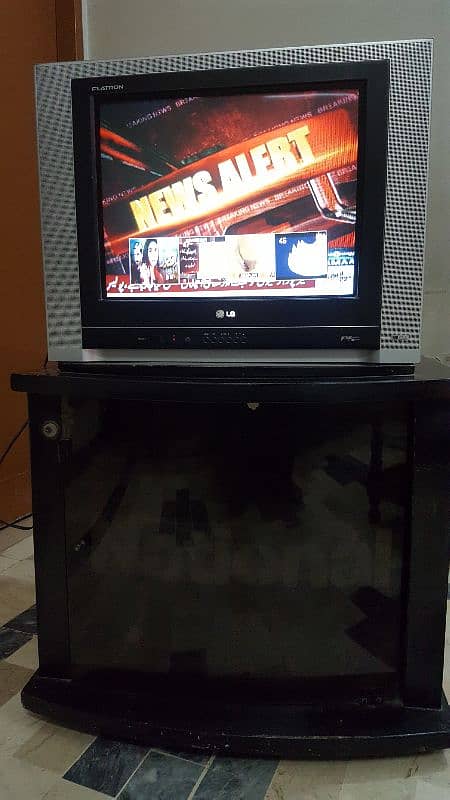 LG 21 inch CRT television with trolly and remote. 6