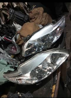 corolla Gli 2010 head lights geniune all body parts 03134963120